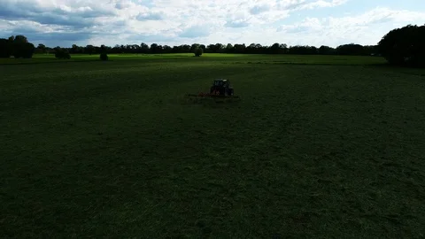 Agricultural tractor returns grass for the haymaking Video stock 117531150