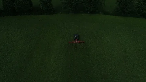 Agricultural tractor returns grass for the haymaking Video stock 117531210