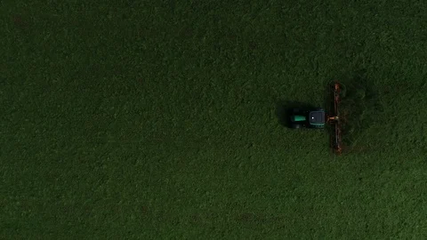 Agricultural tractor returns grass for the haymaking Stock Footage 117531323