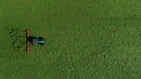 Agricultural tractor returns grass for the haymaking Video stock 117531555