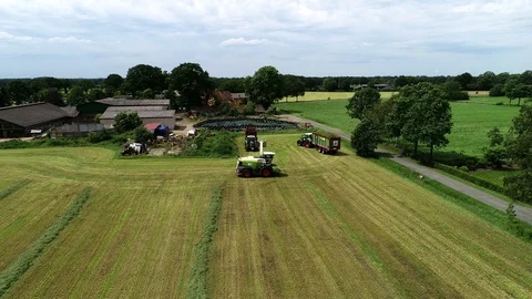 Agricultural tractor returns grass for the haymaking Stock Footage 117620920