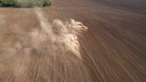 Agricultural tractor sowing seed onto at field. Farming and seeding concept. Vídeo Stock 161970974
