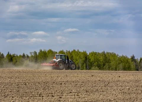 Agricultural work in the field in spring. Stock Photos