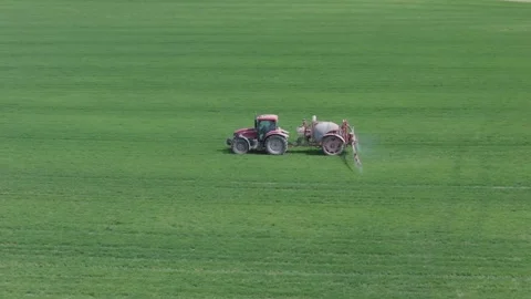Agricultural work with a tractor in crop fields 스톡 동영상 277658997
