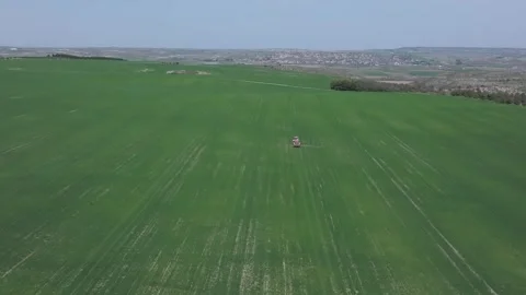 Agricultural work with a tractor in crop fields Stock-Footage 277730699