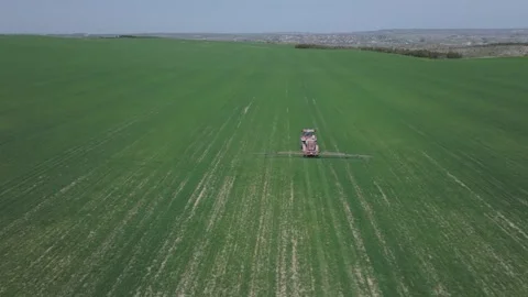 Agricultural work with a tractor in crop fields Vídeos de archivo 277734184