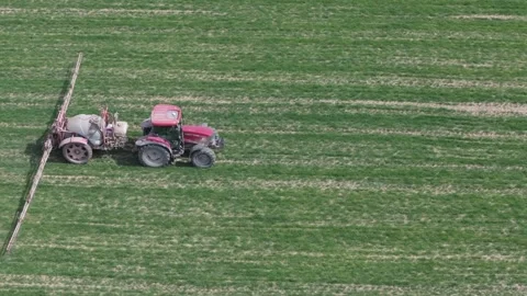 Agricultural work with a tractor in crop fields 스톡 동영상 277738429