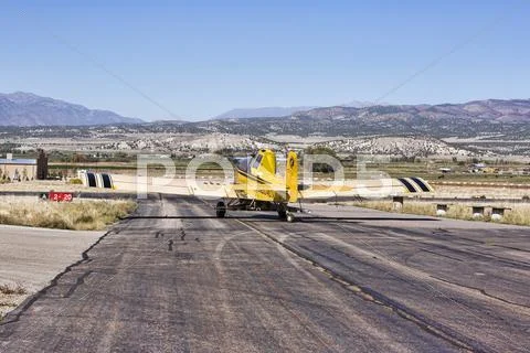 Agriculture aircraft crop duster taxi takeoff runway.jpg Stock Photos