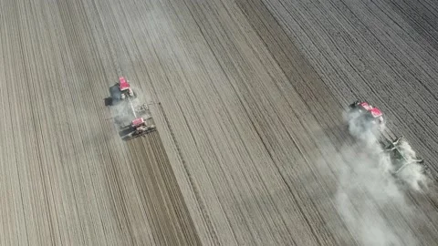 Agriculture field lines and two farmers with tractor. Video stock 128277152