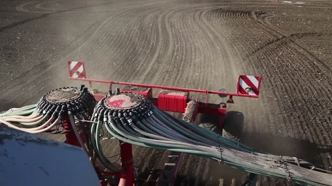 Agriculture tractor working in field. Time of sowing. Planting crops Stock Footage 80437924