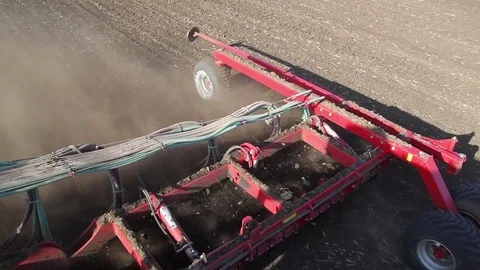 Agriculture tractor working in field. Time of sowing. Planting crops Stock Footage 80437976