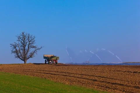 Agriculture trailer and fields Stock Photos