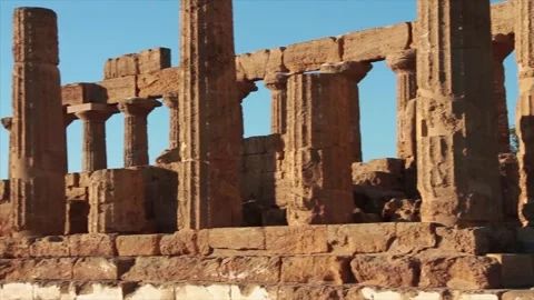 Agrigento sicily italy ancient temple of juno pillars medium shot pan right Stock Footage 252154208