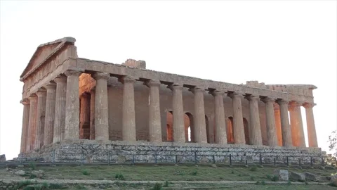 Agrigento sicily italy ancient temple of concordia pillars wide shot from side Stock Footage 252154488