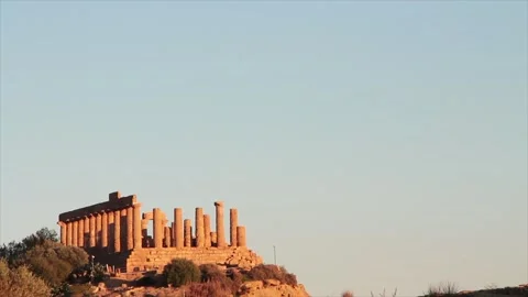 Agrigento sicily italy ancient temple of juno pillars on mountain top peak wide Stock Footage 252154516