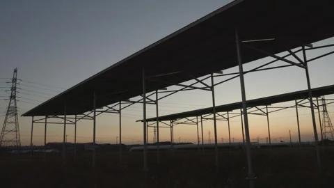Agrivoltaic System at Twilight, Merging Renewable Energy with Farming, Dolly 動画素材 268982243