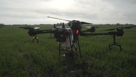 Agro drone works on the field. Field treatment with chemicals. Stock Footage 188807704