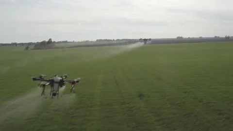 Agro drone works on the field. Field treatment with chemicals. Stock Footage 188825150