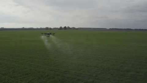 Agro drone works on the field. Field treatment with chemicals. Stock Footage 188825445