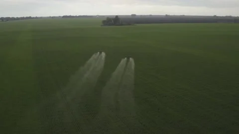 Agro drone works on the field. Field treatment with chemicals. Stock Footage 188825629
