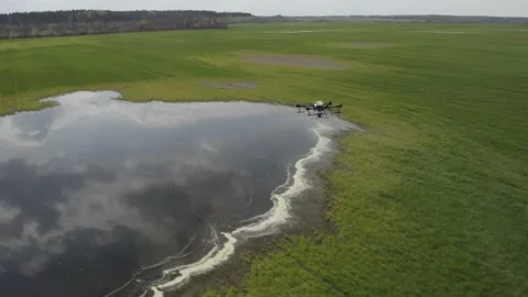Agro drone works on the field. Field treatment with chemicals. Stock Footage 188835477
