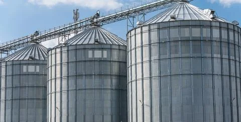 The agro-processing plant showcases multiple silos Stock Photos