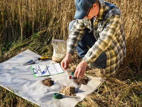Agronomist preparing soil samples for laboratory analysis outdoors Stock Photos