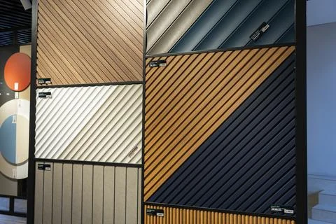 AGT decorative wall panel samples displayed in a building materials showroom Stock Photos