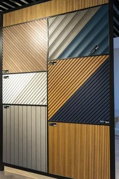 AGT decorative wall panel samples displayed in a building materials showroom Stock Photos