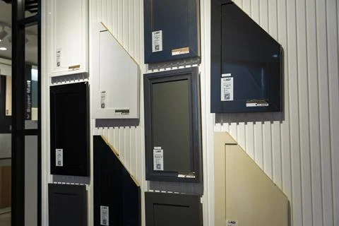 AGT decorative wall panel samples displayed in a building materials showroom Stock Photos