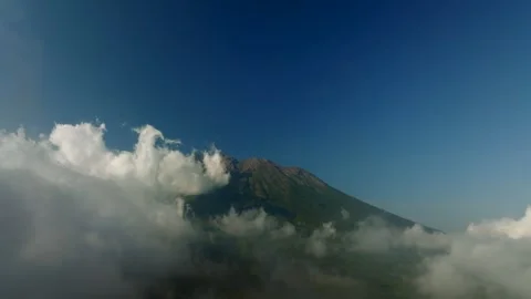 Agung volcano with clouds. Drone view of Bali. Stockbeeldmateriaal 256151357