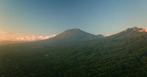 Agung volcano at dawn in Bali. Aerial view of ocean and mountain Stock Footage 276253953