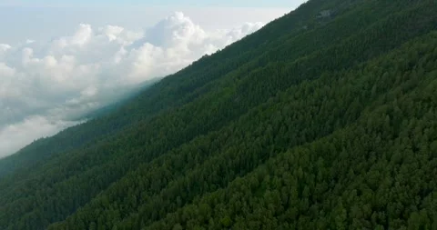 Agung volcano slope with clouds in Bali island. Sacred Mountain Stock Footage 245404975