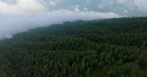 Agung volcano slope with clouds in Bali island. Sacred Mountain Stock Footage 245404977