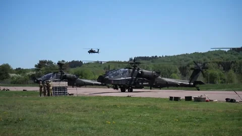 The AH-64 Apache is an American twin-turboshaft attack helicopter 001 Video stock 166438618
