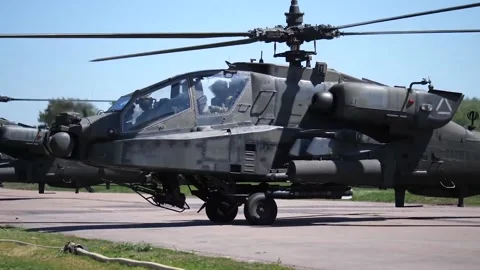 The AH-64 Apache is an American twin-turboshaft attack helicopter 003 Stock Footage 166438637
