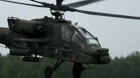 The AH-64 Apache is an American twin-turboshaft attack helicopter 005 Video stock 166438656