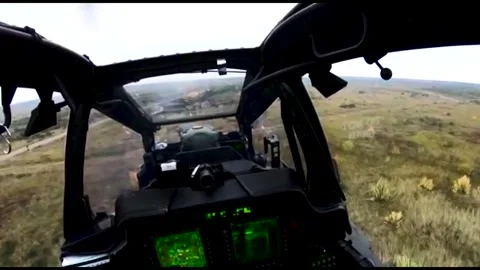 The AH-64 Apache is an American twin-turboshaft attack helicopter 013 Stock Footage 166438804