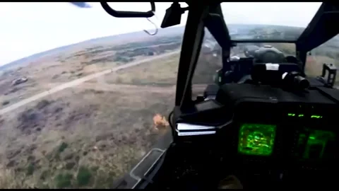 The AH-64 Apache is an American twin-turboshaft attack helicopter 014 Video stock 166438824
