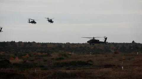The AH-64 Apache is an American twin-turboshaft attack helicopter 018 Stock Footage 166438871