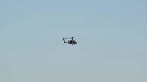 The AH-64 Apache is an American twin-turboshaft attack helicopter 024 Stock Footage 166439018