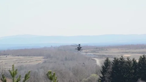 The AH-64 Apache is an American twin-turboshaft attack helicopter 023 Stock Footage 166439033