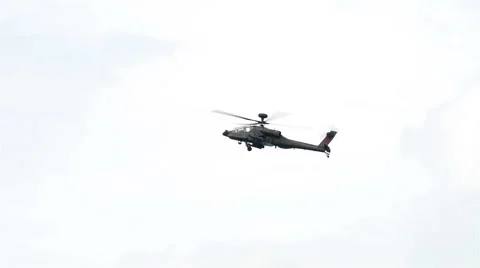 The AH-64 Apache during the Aerobatic Flying Displays at Singapore Airshow Stock Footage 67190217