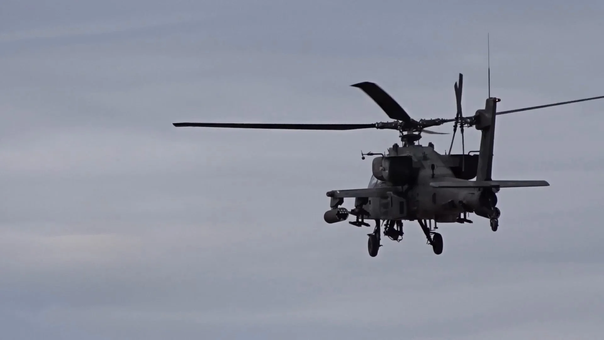 AH-64 Apache helicopter firing rocket | Stock Video | Pond5