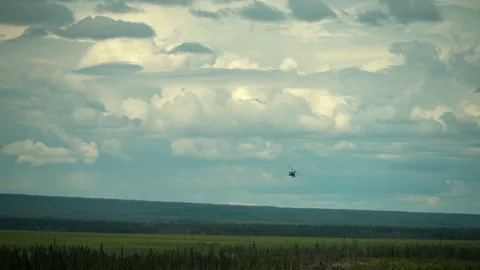 AH-64 Apache helicopter flying during close air support exercise Red Flag Alaska Stock Footage 110843708