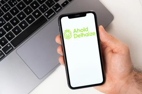 Ahold Delhaize mobile application on the smartphone screen. Make purchases while Stock Photos