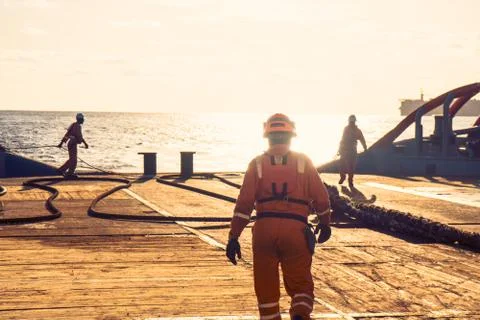 AHTS vessel doing static tow tanker lifting. Ocean tug job Stock Photos