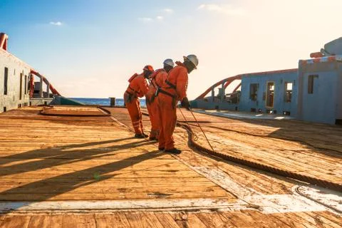 AHTS vessel doing static tow tanker lifting. Ocean tug job Stock Photos
