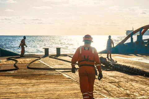 AHTS vessel doing static tow tanker lifting. Ocean tug job Stock Photos