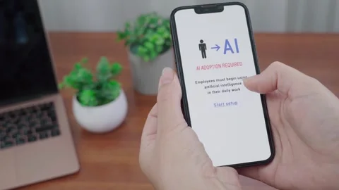 AI Adoption Required Notification on Phone in Modern Desk Setup Stock Footage 340998092